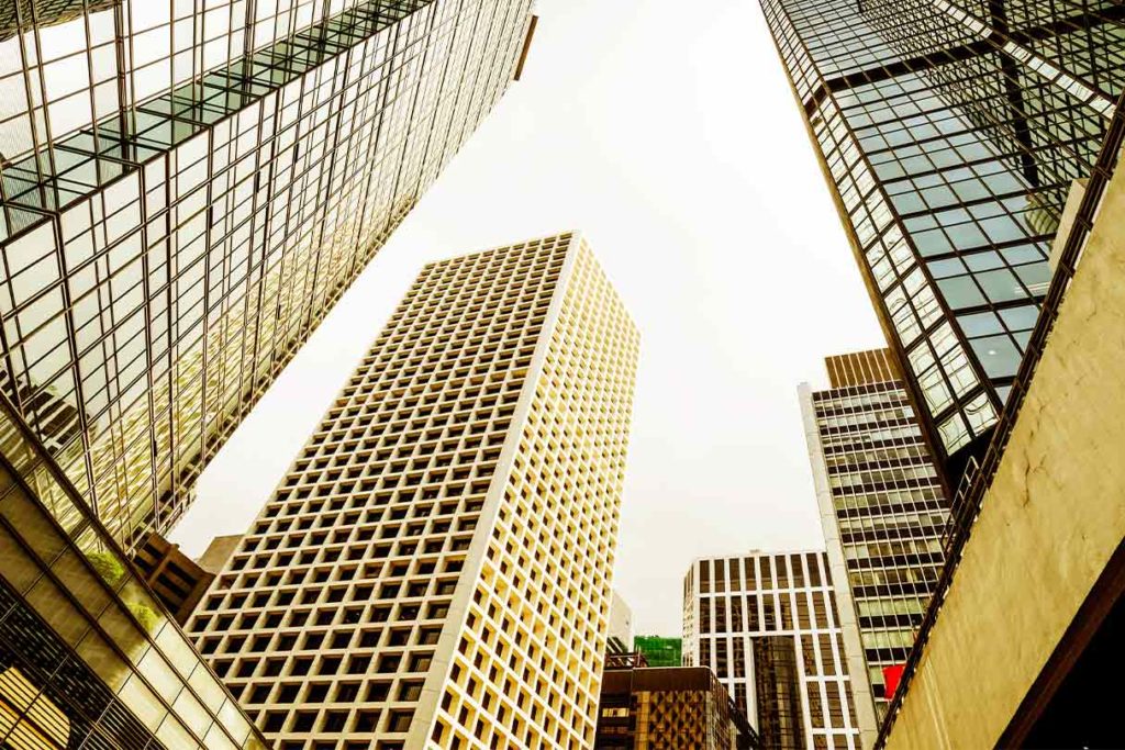 Looking up at tall skyscrapers